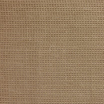 Close-up of a textured brown fabric surface