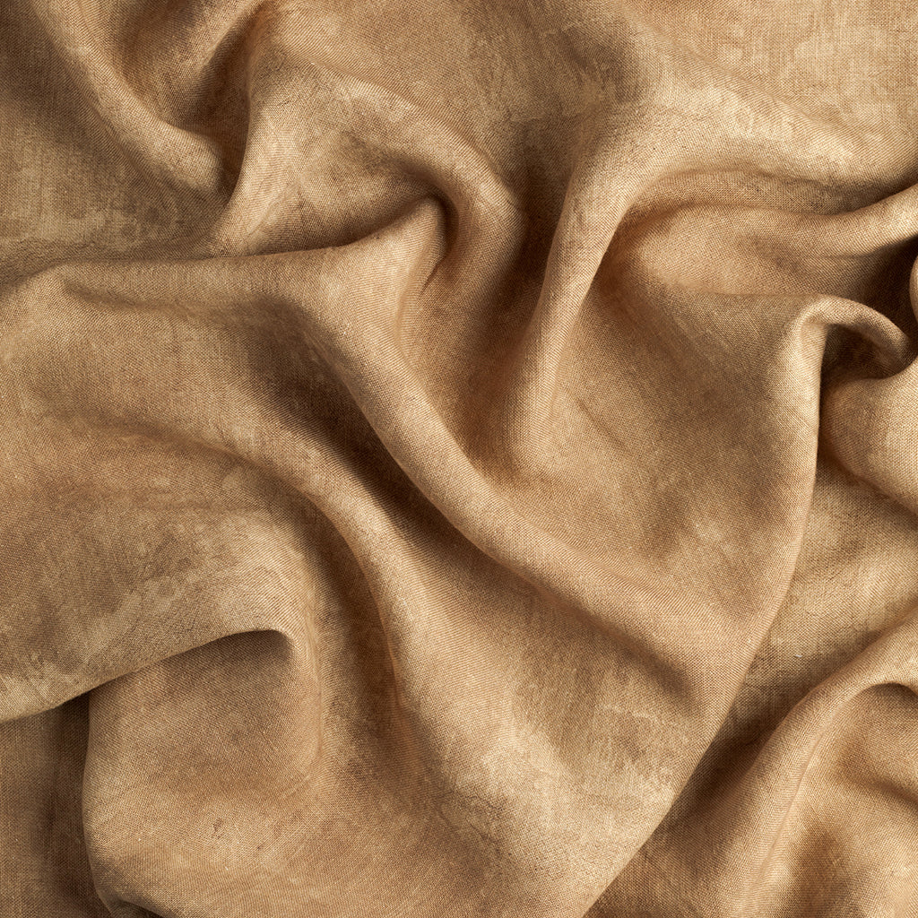Close-up of beige fabric with folds
