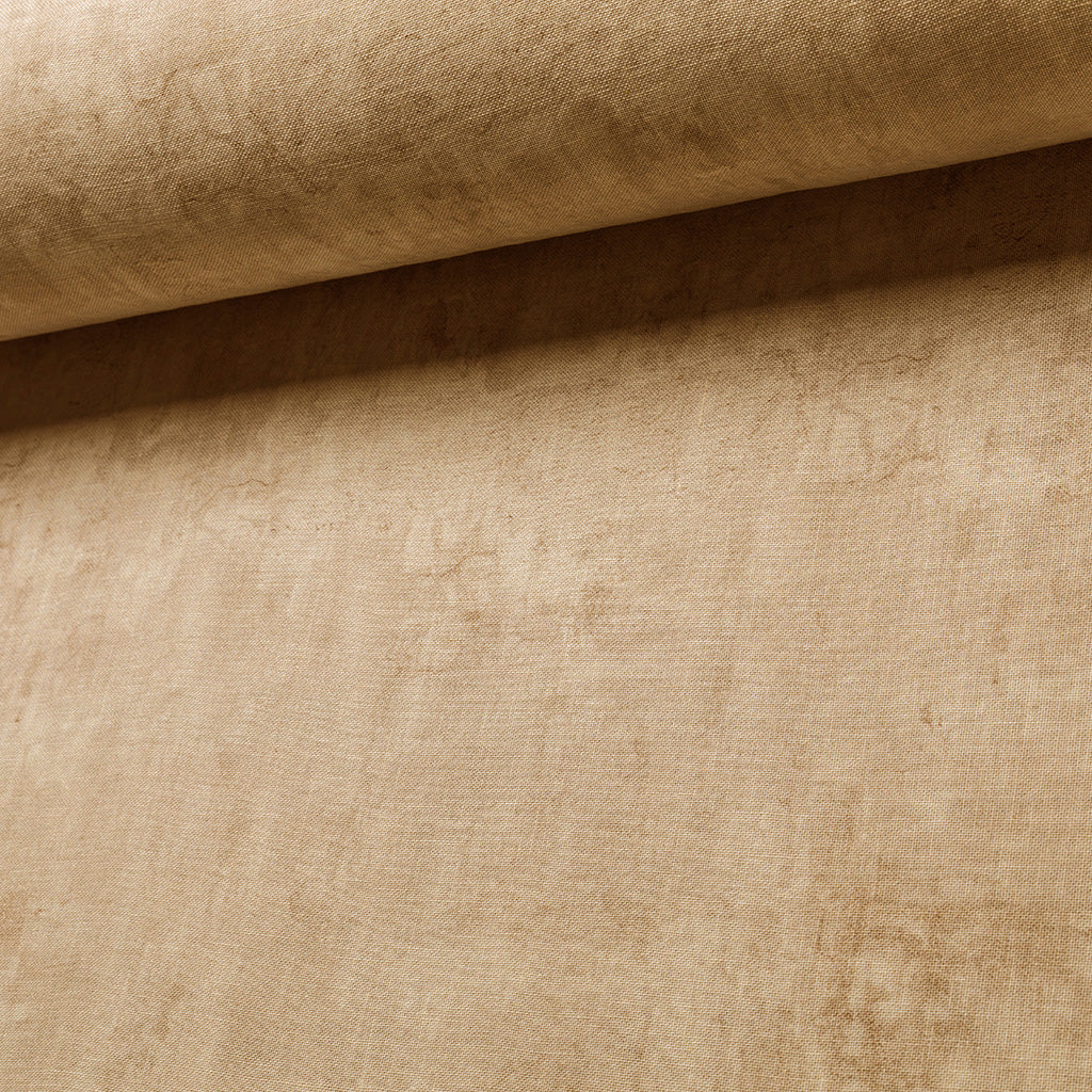 Close-up of beige fabric with a textured pattern