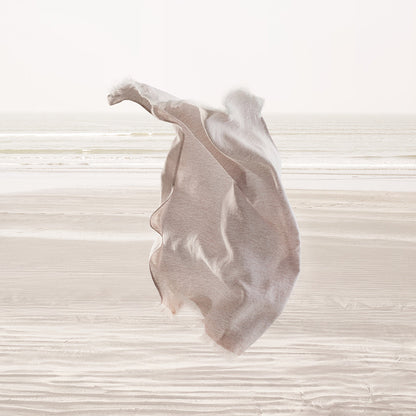 Light pink fabric on a textured white background